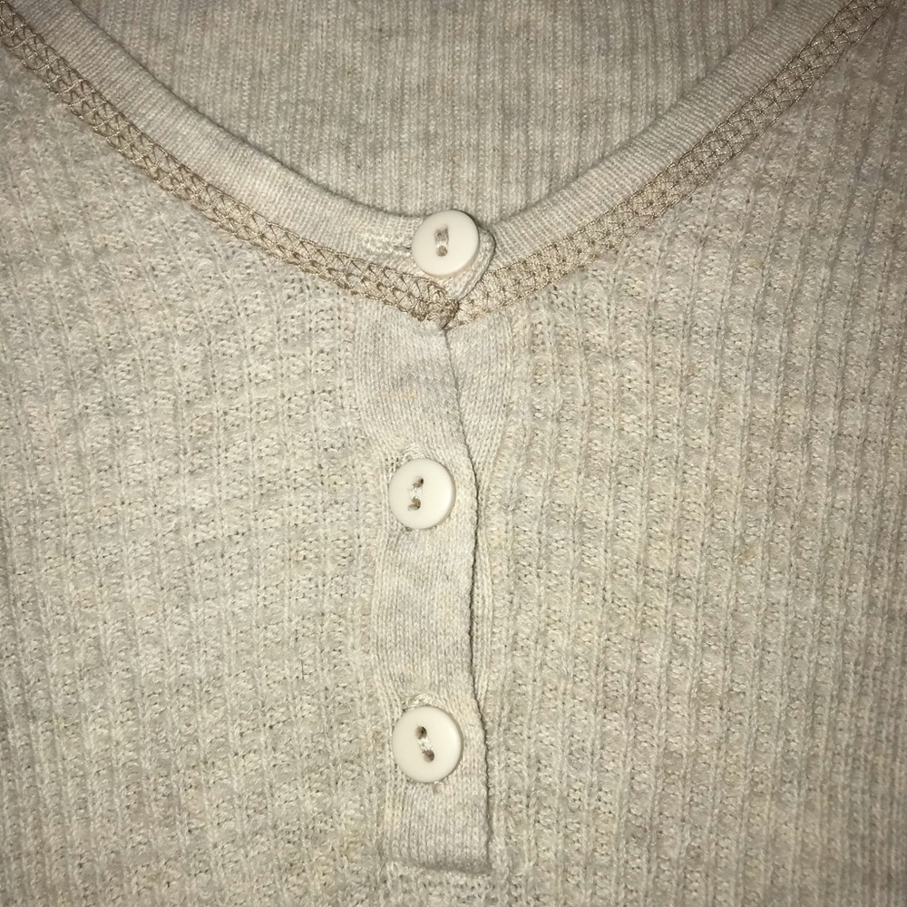 Tight fit long sleeved tee with a few buttons